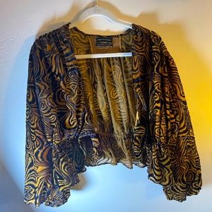 Urban Outfitters tie-front blouse with black and mustard print